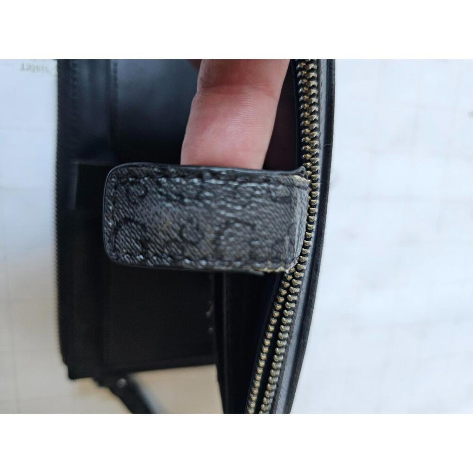 GUESS Classic Black Logo-Embossed Wallet Wristlet