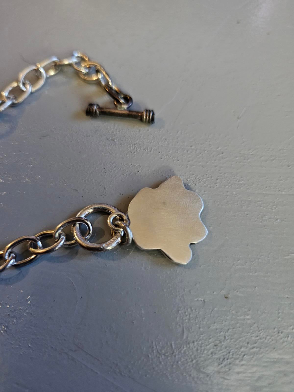 Chain Reaction: Paw Print Charm Bracelet for Fierce Wrist Action