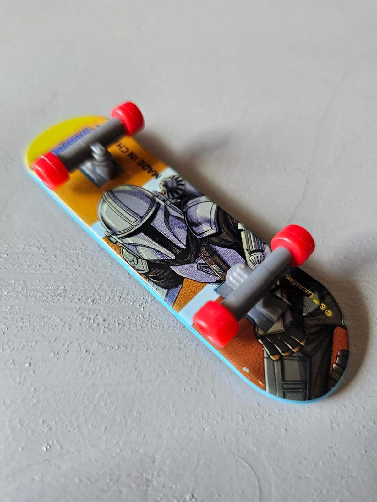Star Wars The Mandalorian Mini Finger Skateboard Toy – Blue Deck with Red Wheels